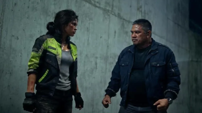 Lia faces Tano in a concrete parking-garage stairwell