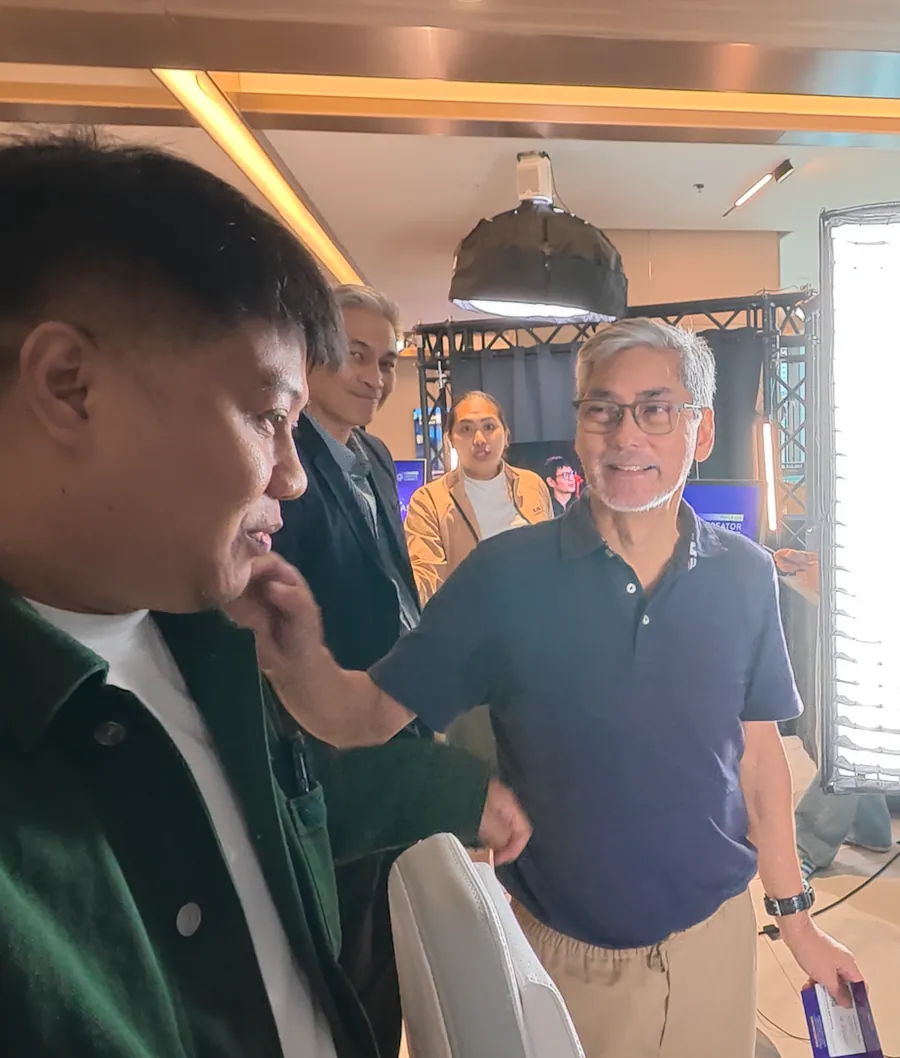 Nico Babierra with Oscar &ldquo;Oca&rdquo; Barbin, in glasses and a navy polo, at the Post-Production zone of ProArt Creator Connect Manila 2026