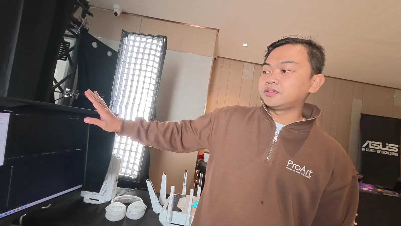ASUS representative explaining a ProArt monitor at the Post-Production zone